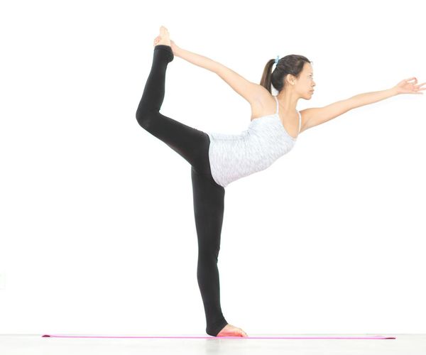 Graceful movement showing flexibility and calm strength in yoga.